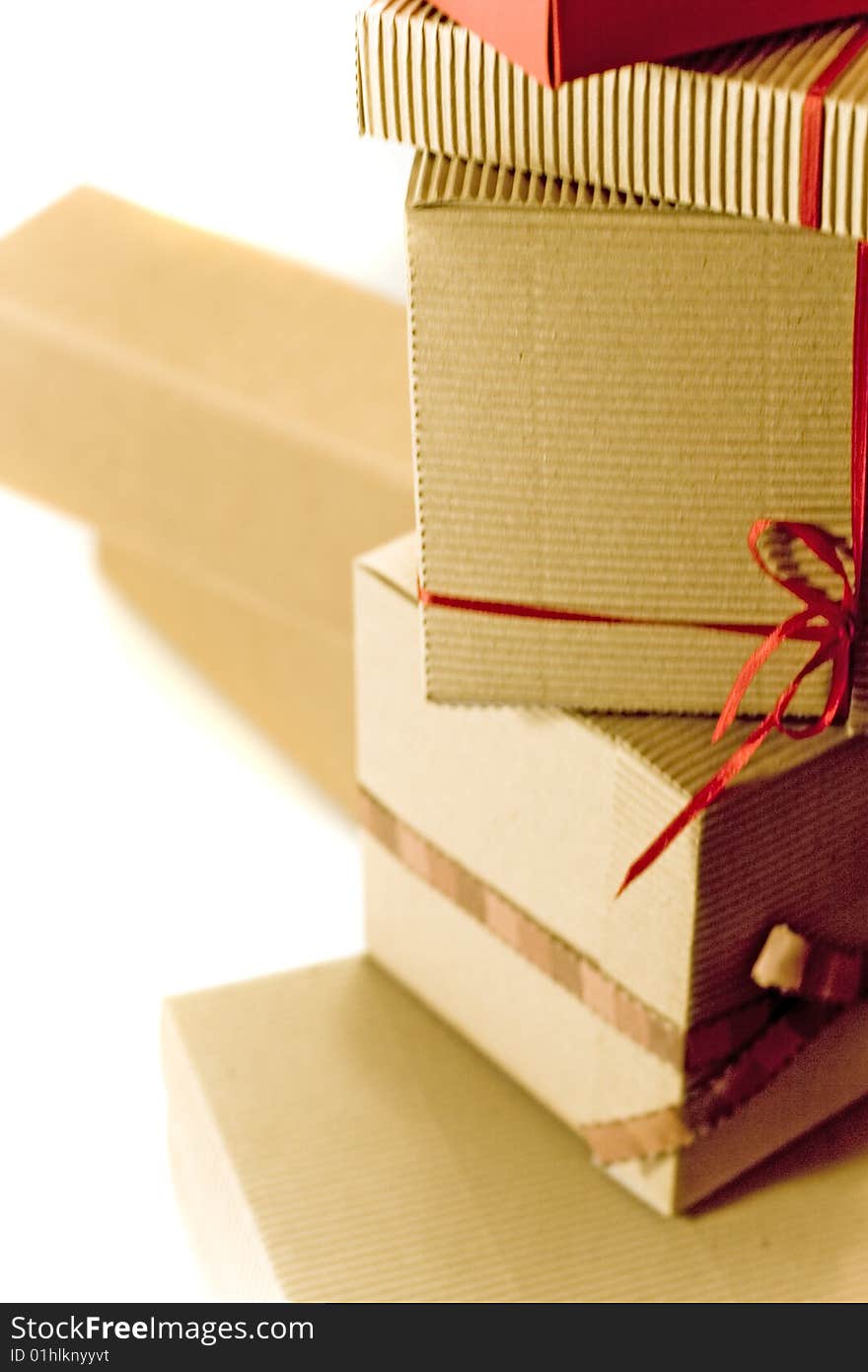 Stack of cardboard boxes close up on white background