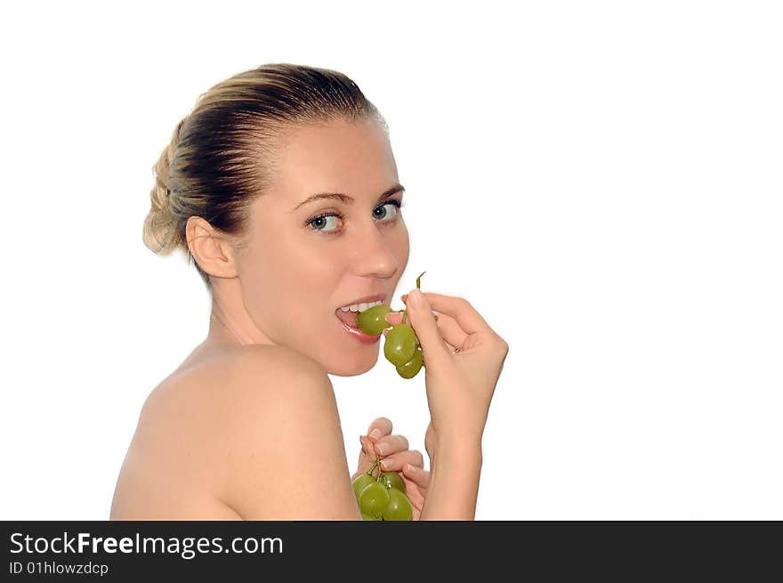 Portrait of sexy young women with beautiful face and green grapes. Portrait of sexy young women with beautiful face and green grapes