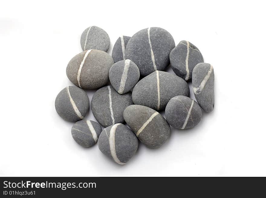 An isolated balanced stone on white