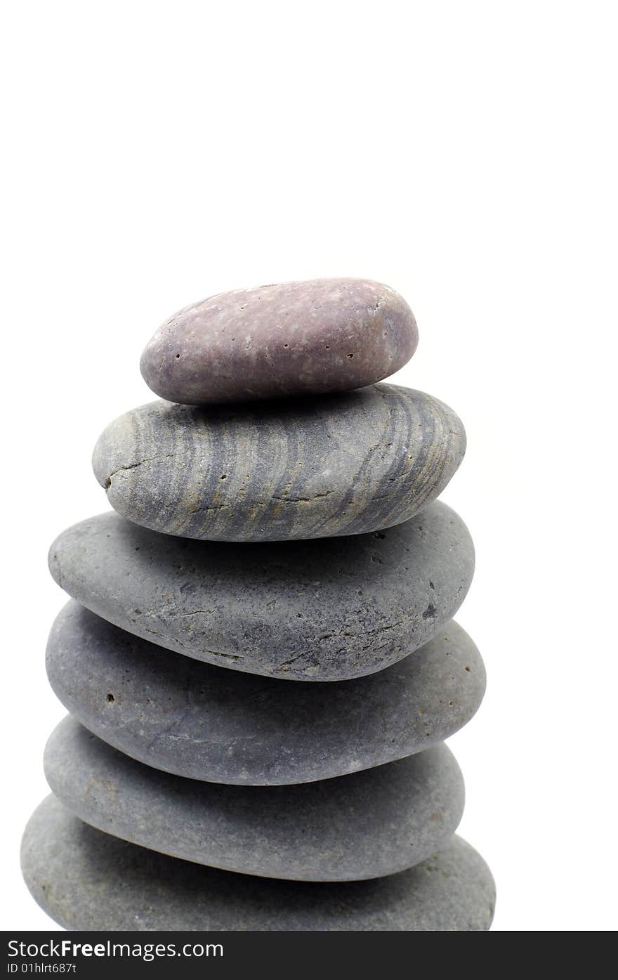 Stack of smooth pebbles over white background. Stack of smooth pebbles over white background