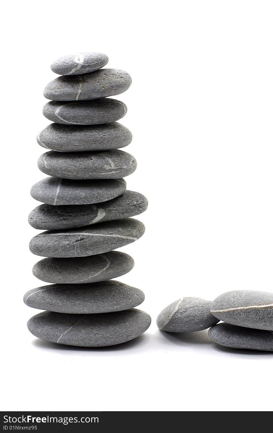 Stack of smooth pebbles over white background. Stack of smooth pebbles over white background