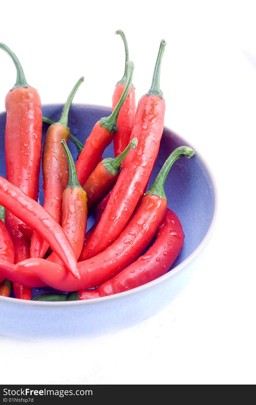 Red chillis in blue bowl