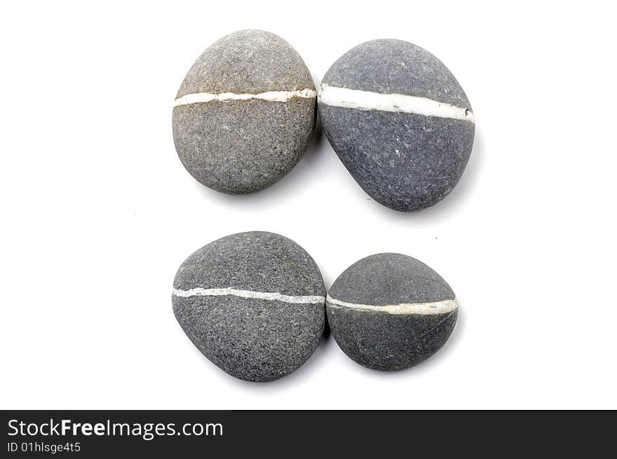 Stack of smooth pebbles over white background. Stack of smooth pebbles over white background