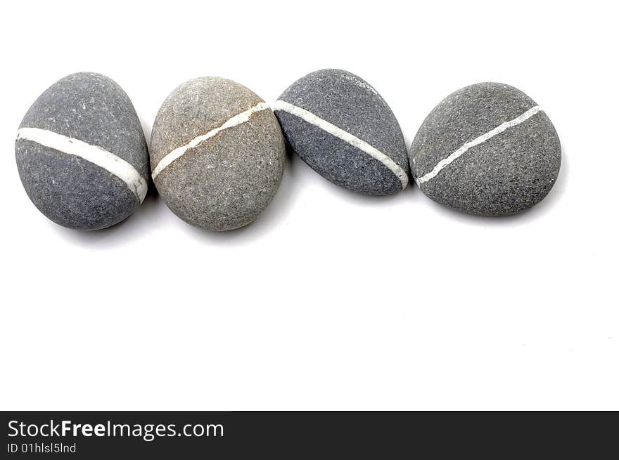 Stack of smooth pebbles over white background. Stack of smooth pebbles over white background