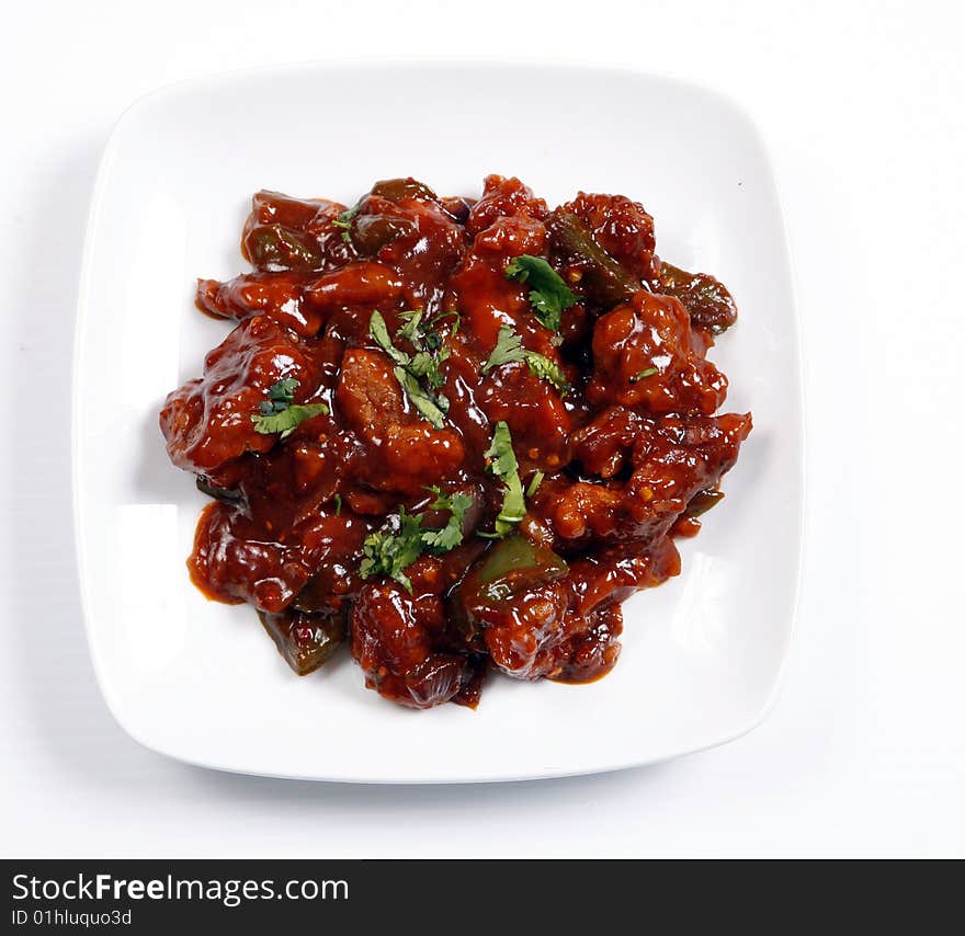 Chilli chicken ready to serve in plate. Chilli chicken ready to serve in plate