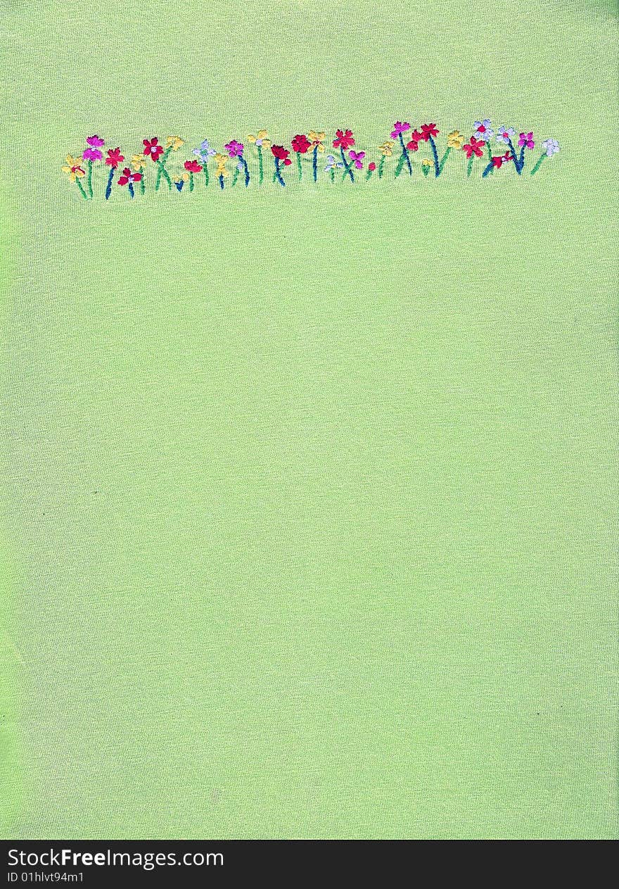 Floral embroidery on green background. Floral embroidery on green background.