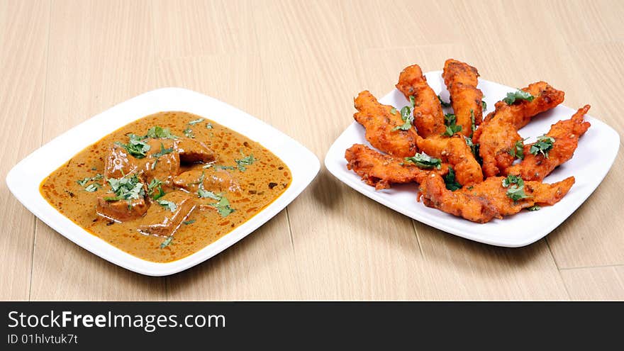 Tasty and spicy fried fish in white plate ready to eat. Tasty and spicy fried fish in white plate ready to eat