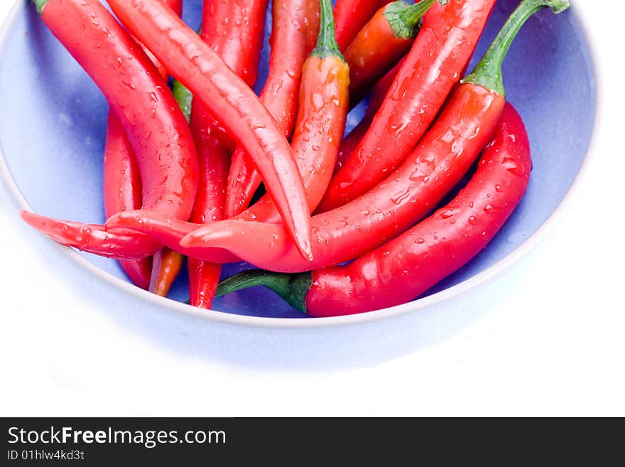 Red hot chili peppers in a blue bowl. Red hot chili peppers in a blue bowl