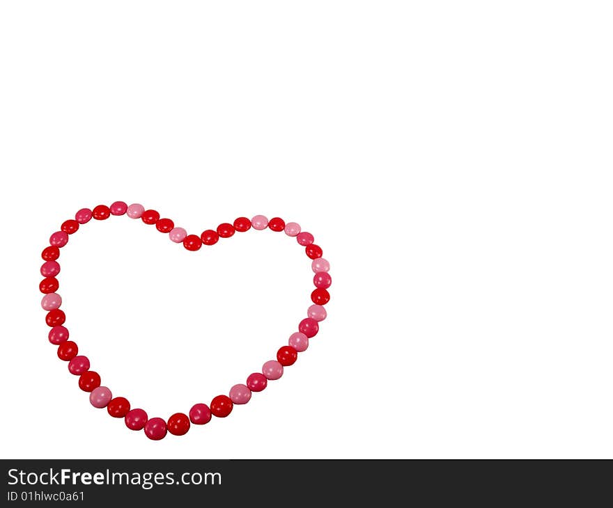 Valentine Candy in a Heart Shape on a White Background. Valentine Candy in a Heart Shape on a White Background.