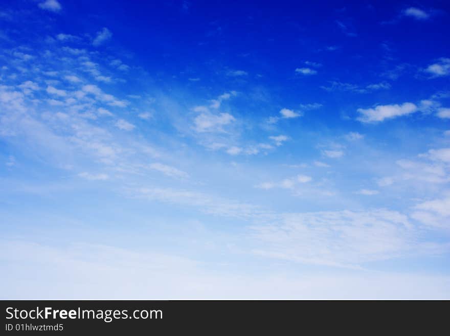 Aerial view of cloudy blue sky from aircraft window. Aerial view of cloudy blue sky from aircraft window.