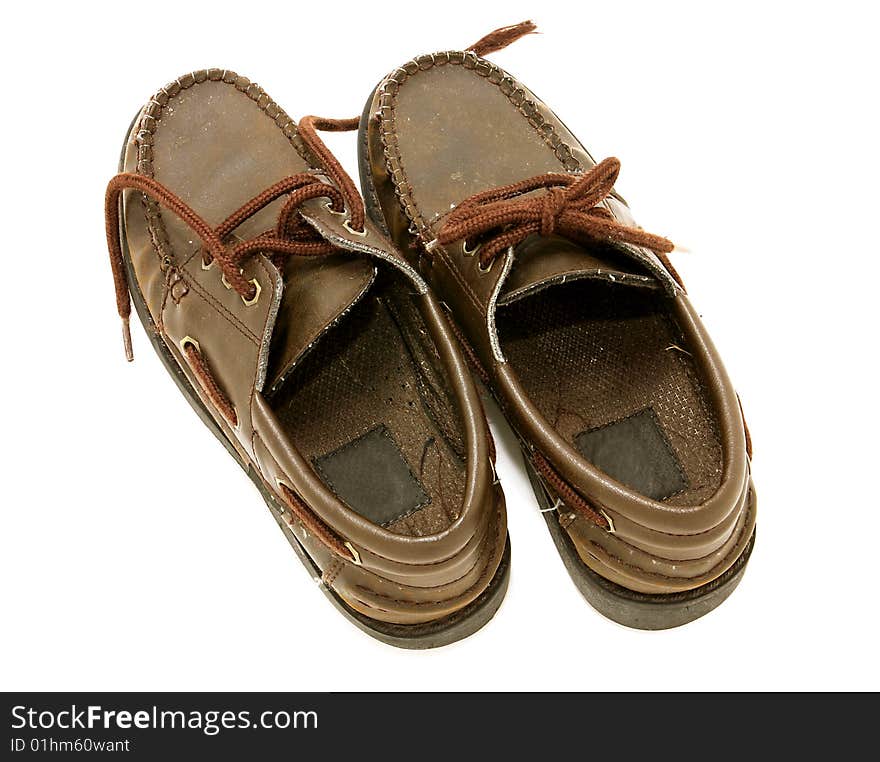 Boys size worn leather shoes, isolated on white