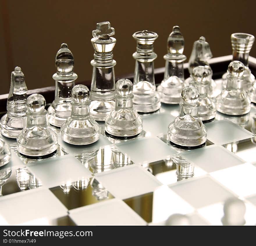 Glass chessboard with first beginning position of pawn