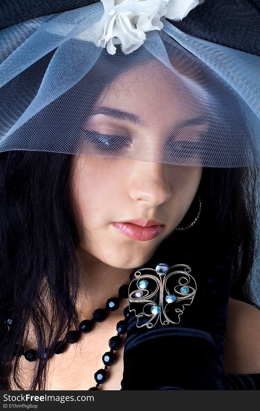 Series. Portrait of the beautiful brunette in a dark blue dress