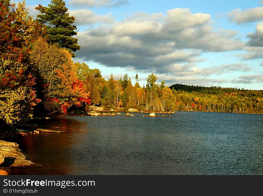 Fall comes to a bay on Flack Lake