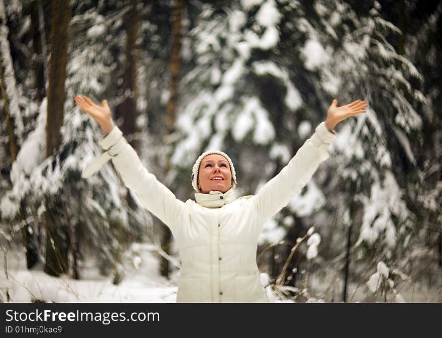 Photo of laughing woman in winter forest