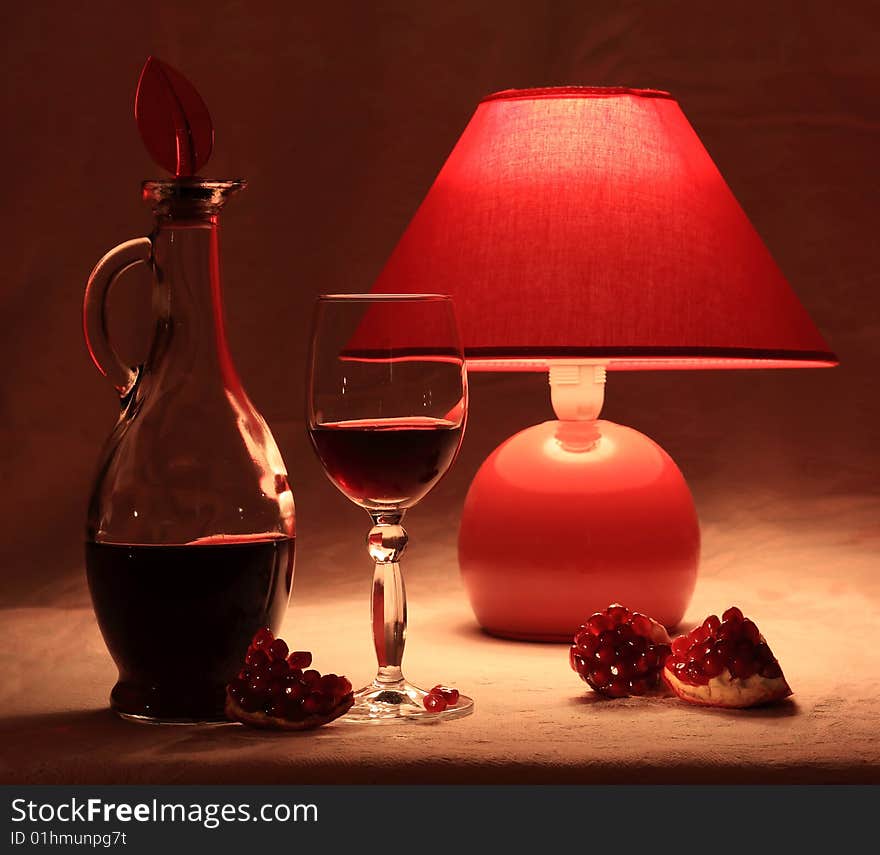 Red pomegranate wine and red lamp. Red pomegranate wine and red lamp.