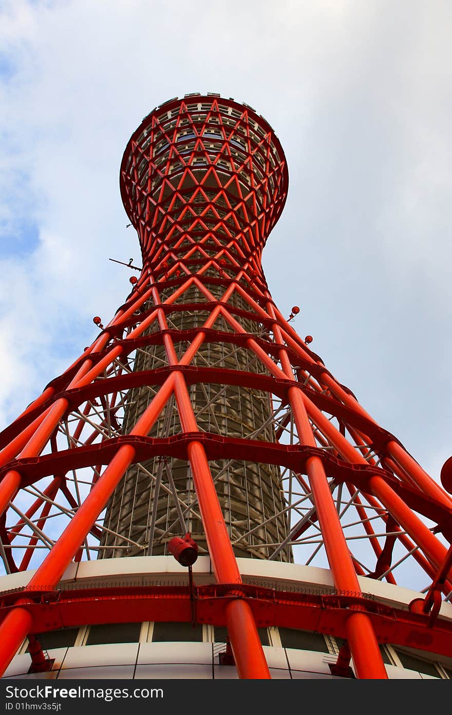 Day time view of the red port tower surrounded by blue sky near the harbor area in Kobe city, Japan. Day time view of the red port tower surrounded by blue sky near the harbor area in Kobe city, Japan