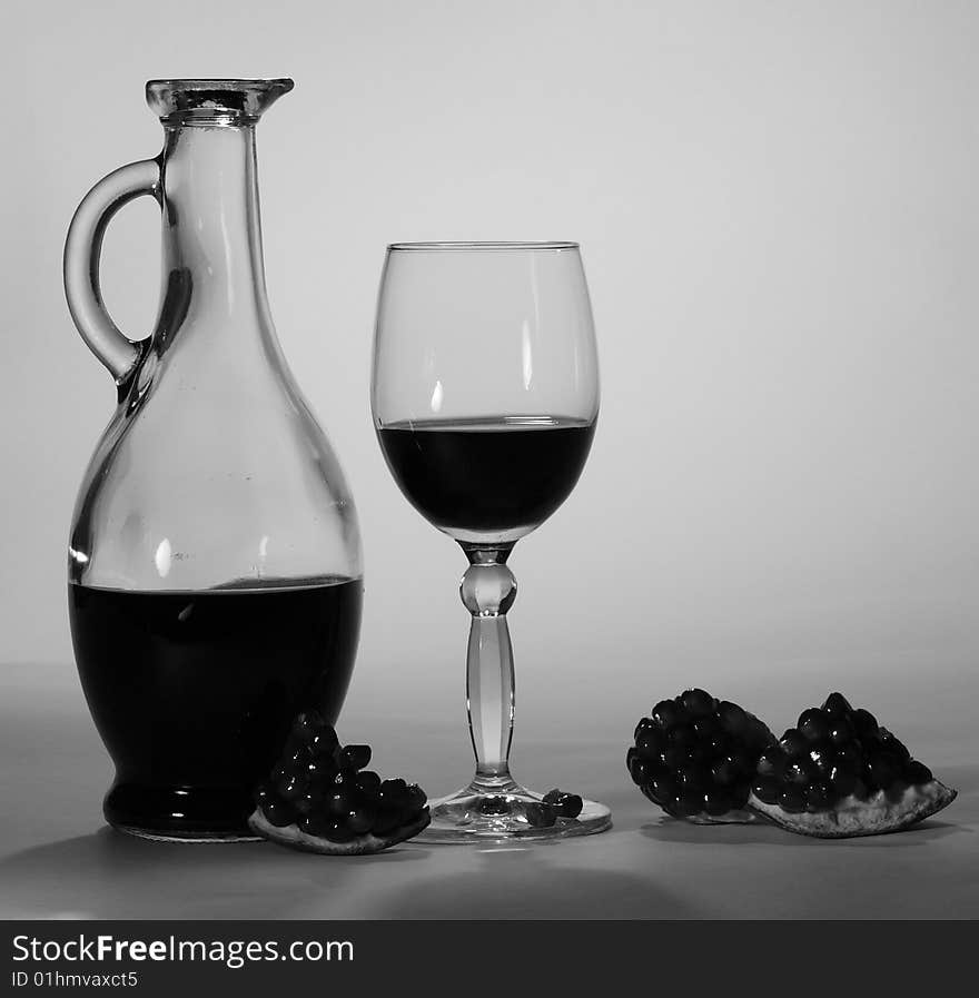 Red pomegranate wine. Black-and-white picture. Red pomegranate wine. Black-and-white picture.