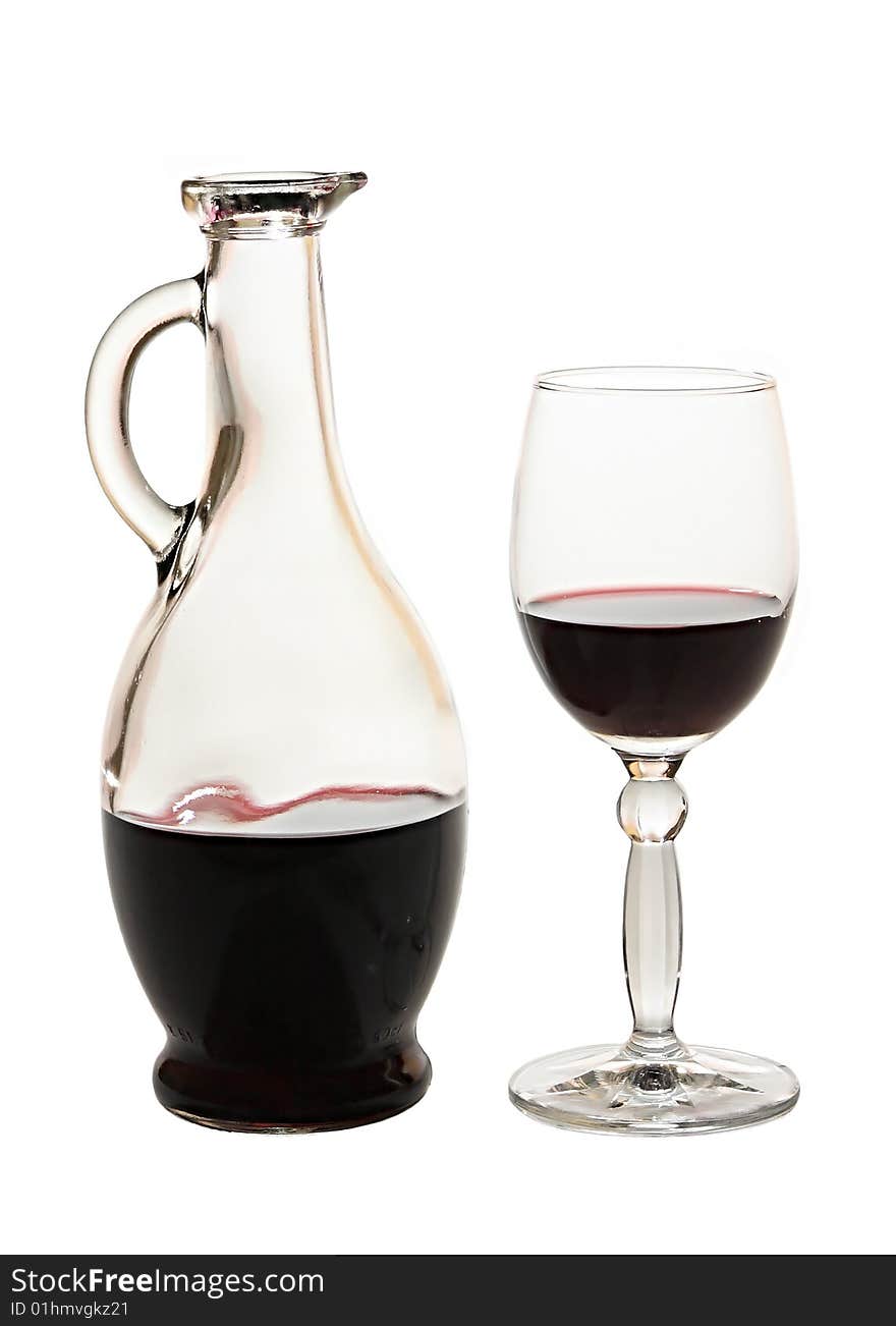 Jug and glass with red wine.