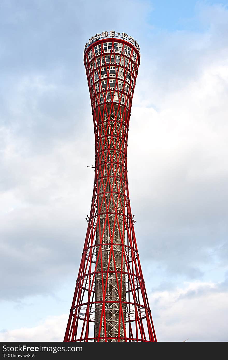 Day time view of the red port tower surrounded by blue sky near the harbor area in Kobe city, Japan. Day time view of the red port tower surrounded by blue sky near the harbor area in Kobe city, Japan