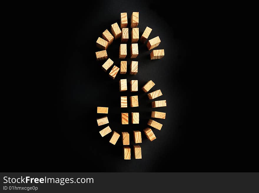 Building blocks US dollar symbol isolated on a black background