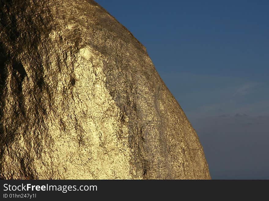 Texture of Kyaiktiyo Boulder Stupa (Golden Rock), Mon State, Myanmar (Burma).