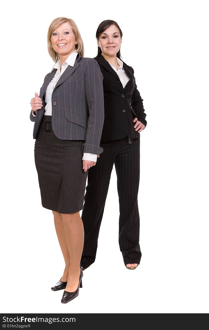 Two businesswomen isolated on white background. Two businesswomen isolated on white background