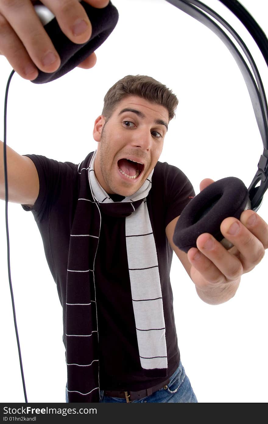 Shouting male holding headphone on an isolated white background