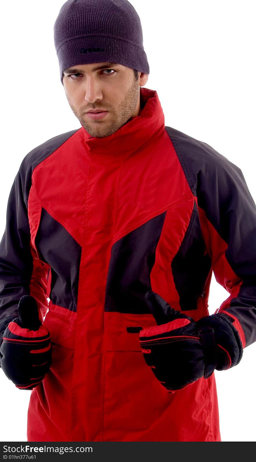 Portrait of young handsome guy wearing winter clothes on an isolated background