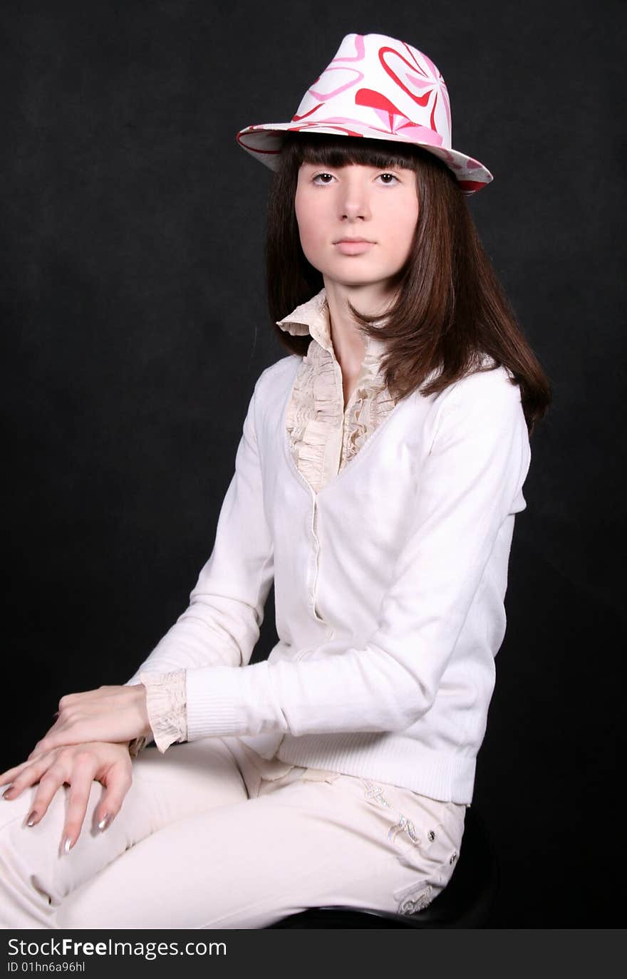 Pretty girl sitting in studio