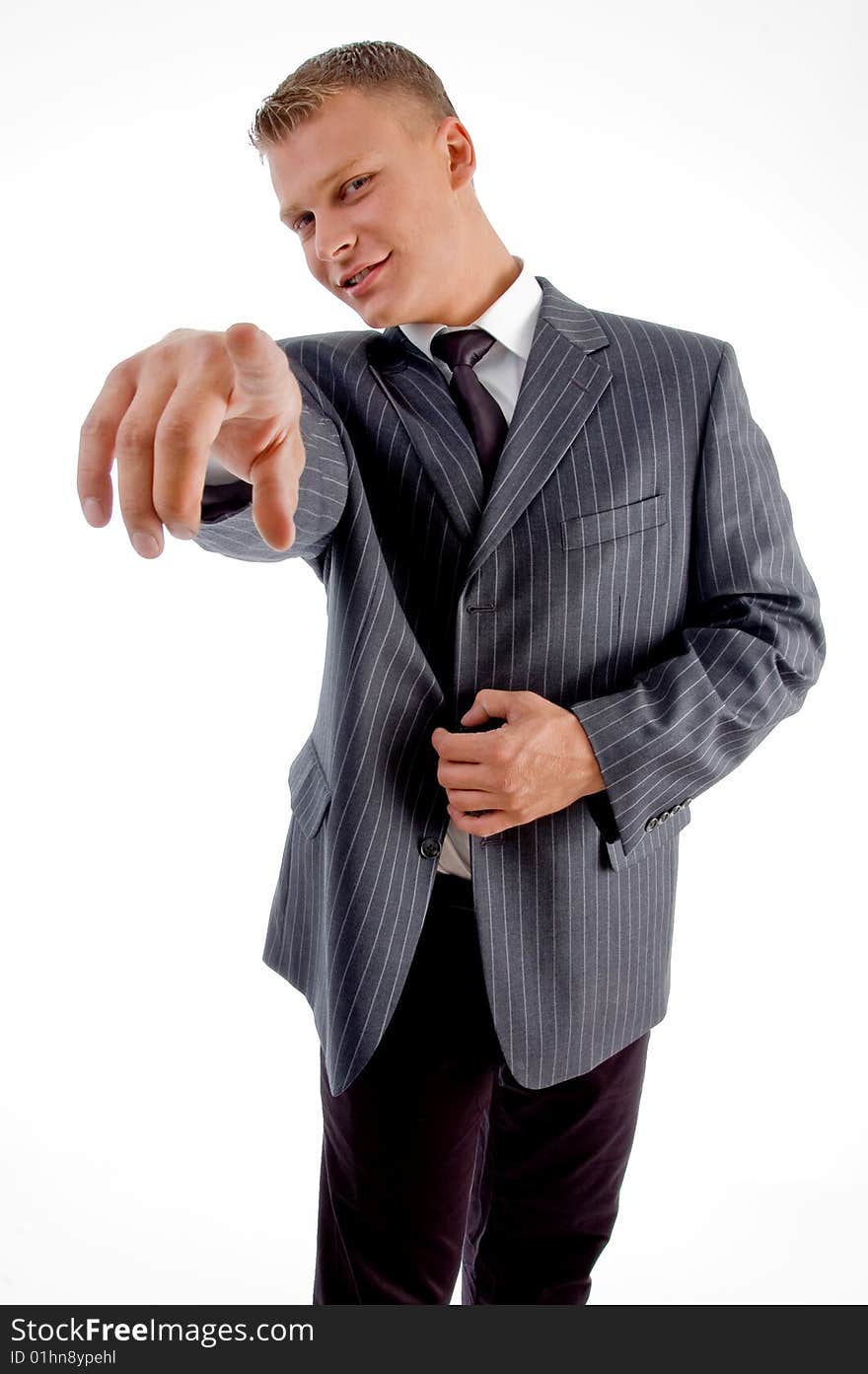 Handsome young businessman pointing at camera on an isolated white background