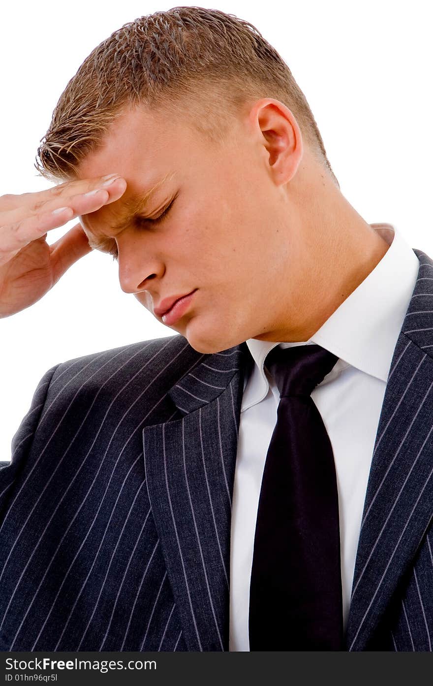 Businessman holding head in tension