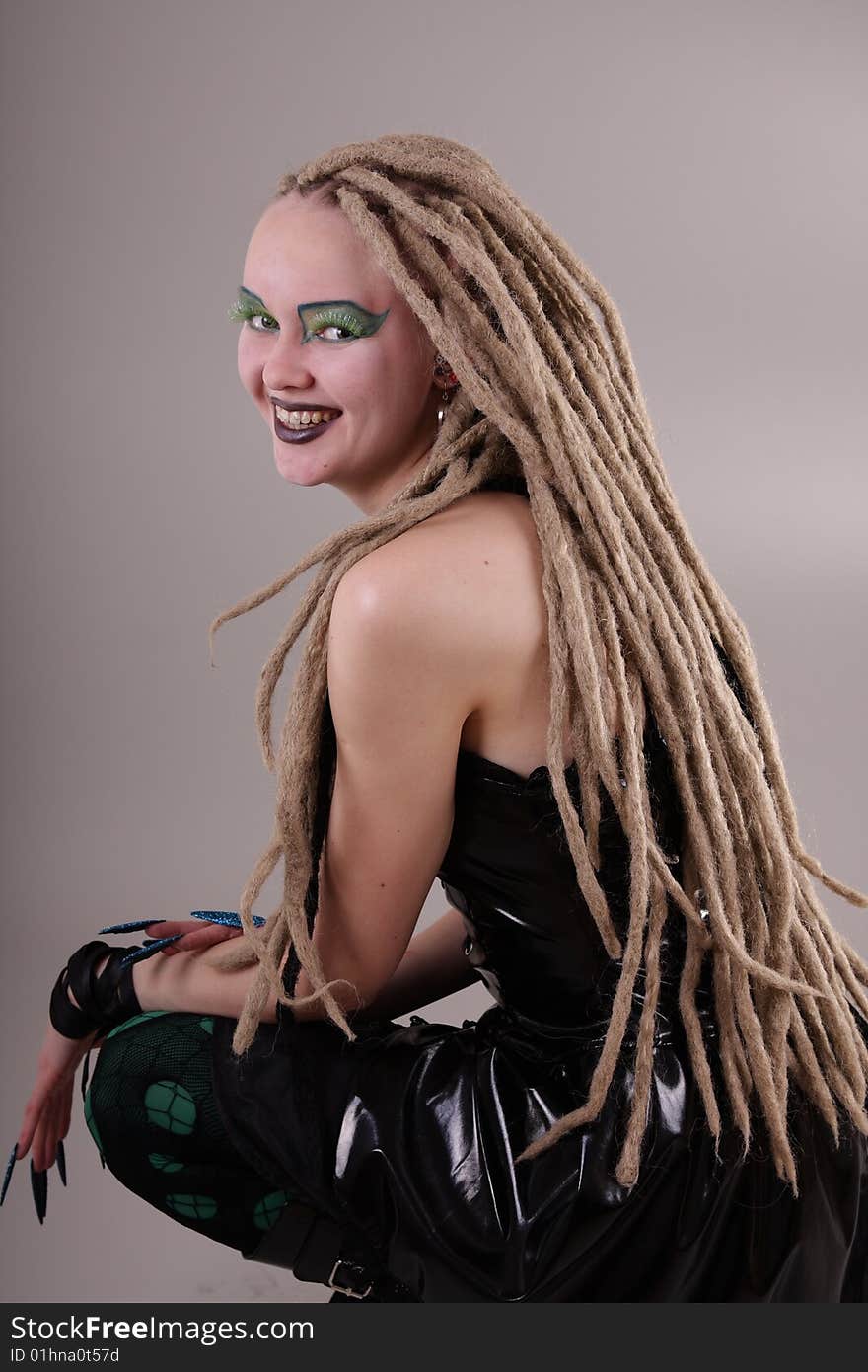 Young woman with dread locks and punk clothing. Young woman with dread locks and punk clothing