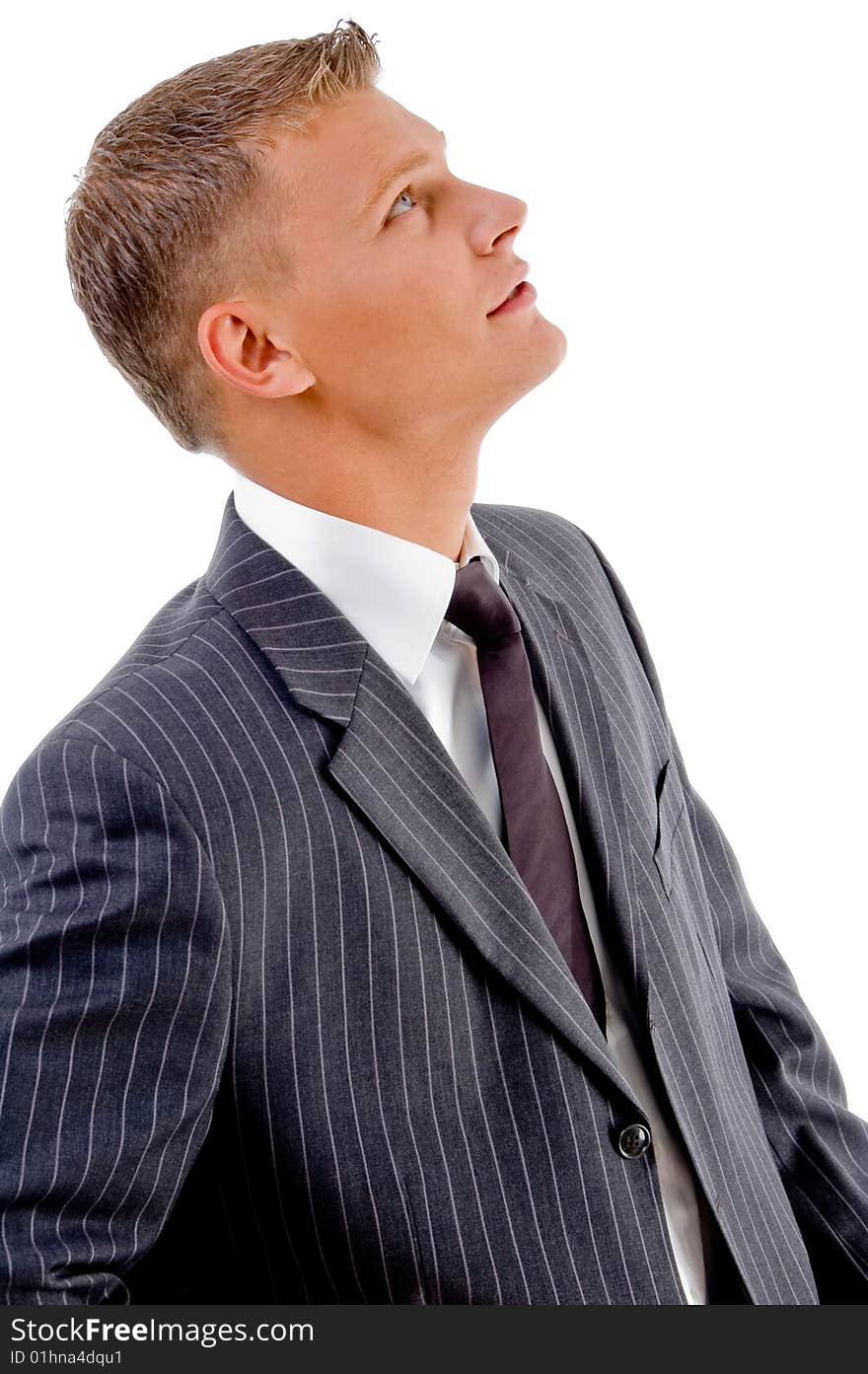 Side pose of young businessman looking upward on an isolated white background