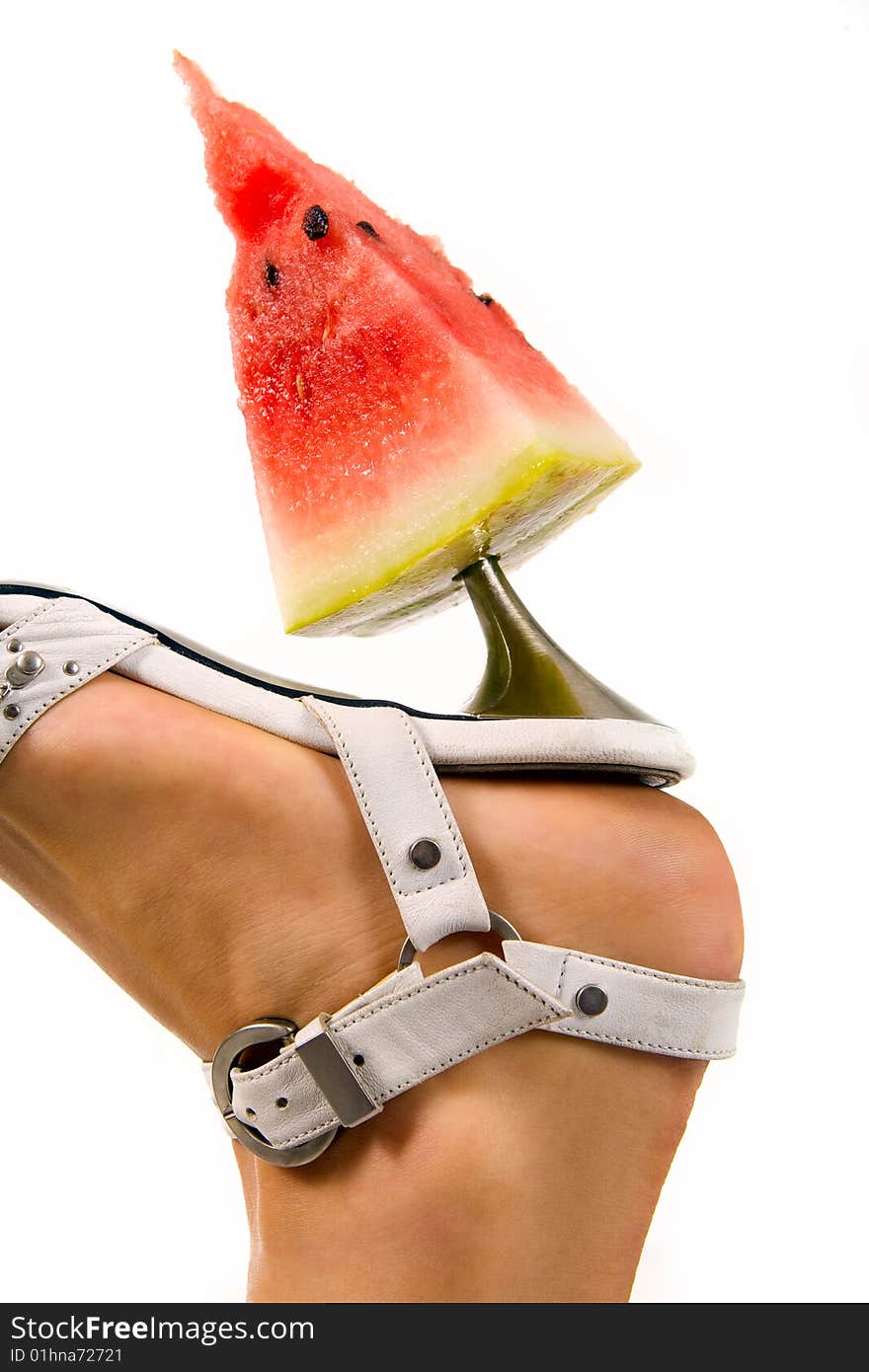 Woman s leg with slice of watermelon