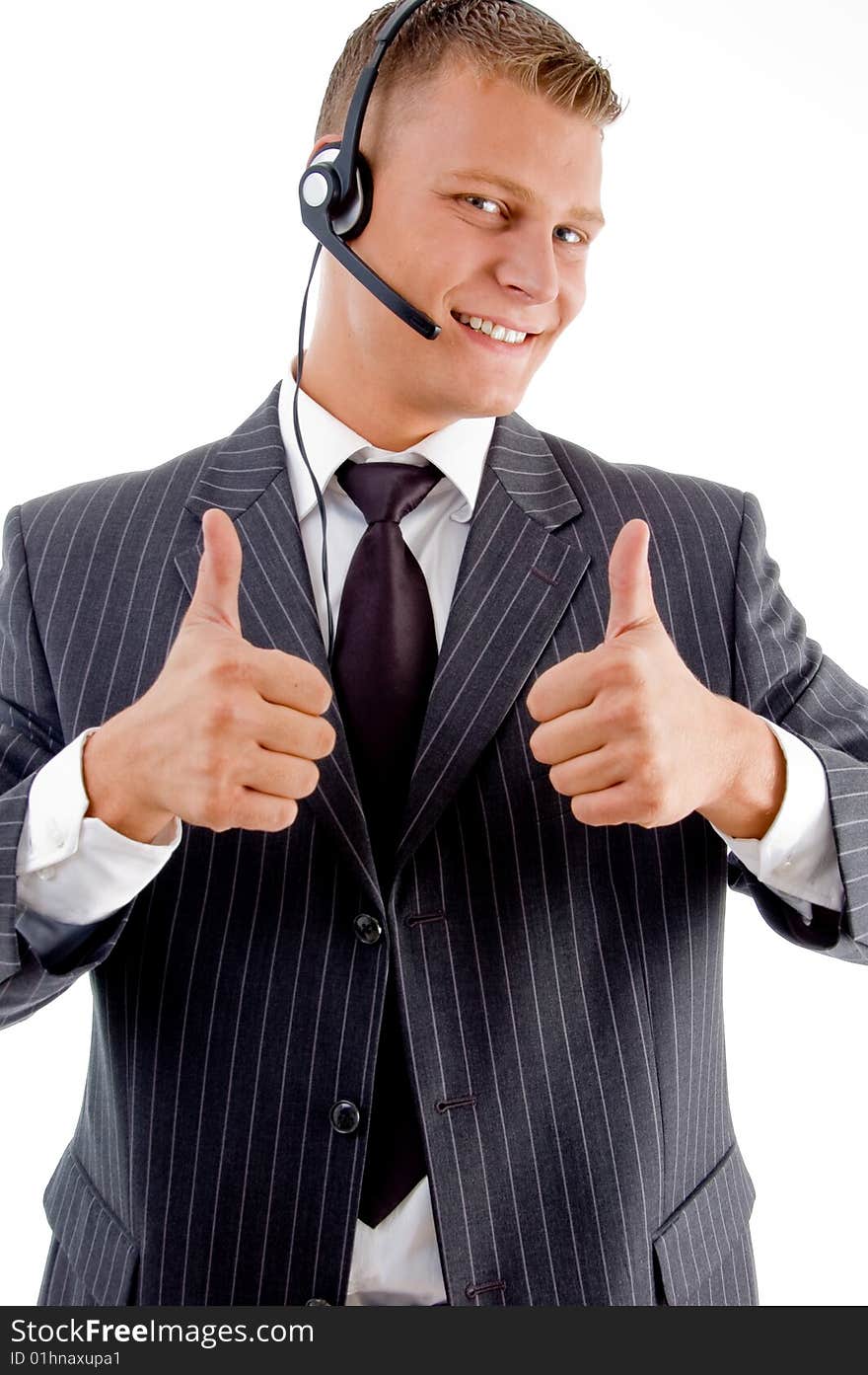 Successful businessman with thumbs up on an isolated white background