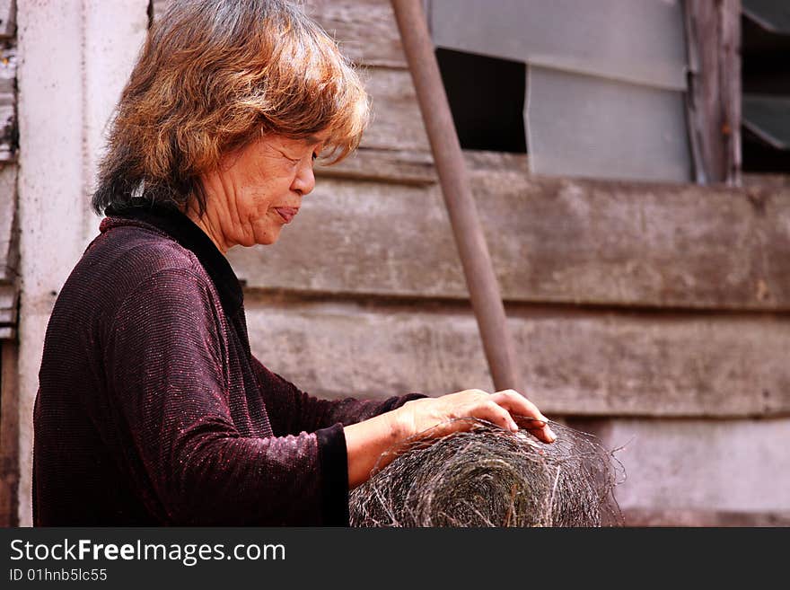 Old female worker at a re-construction site. Old female worker at a re-construction site