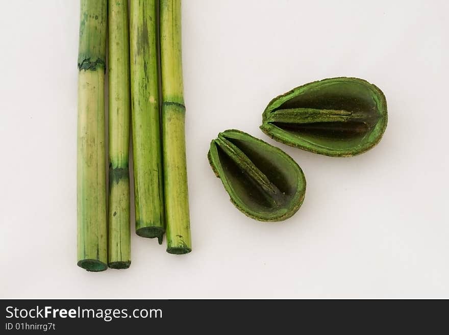 Composition whit bamboo sticks and green leaves