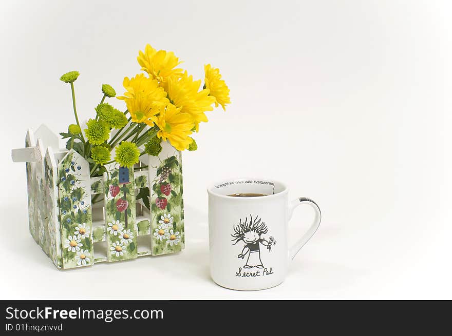 Coffee cup with yellow flowers