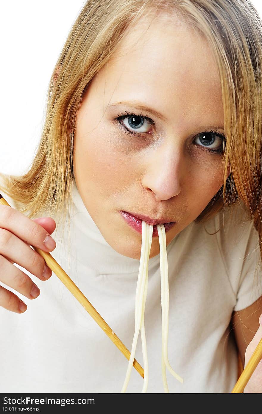 Blond woman use chopsticks eating noodles