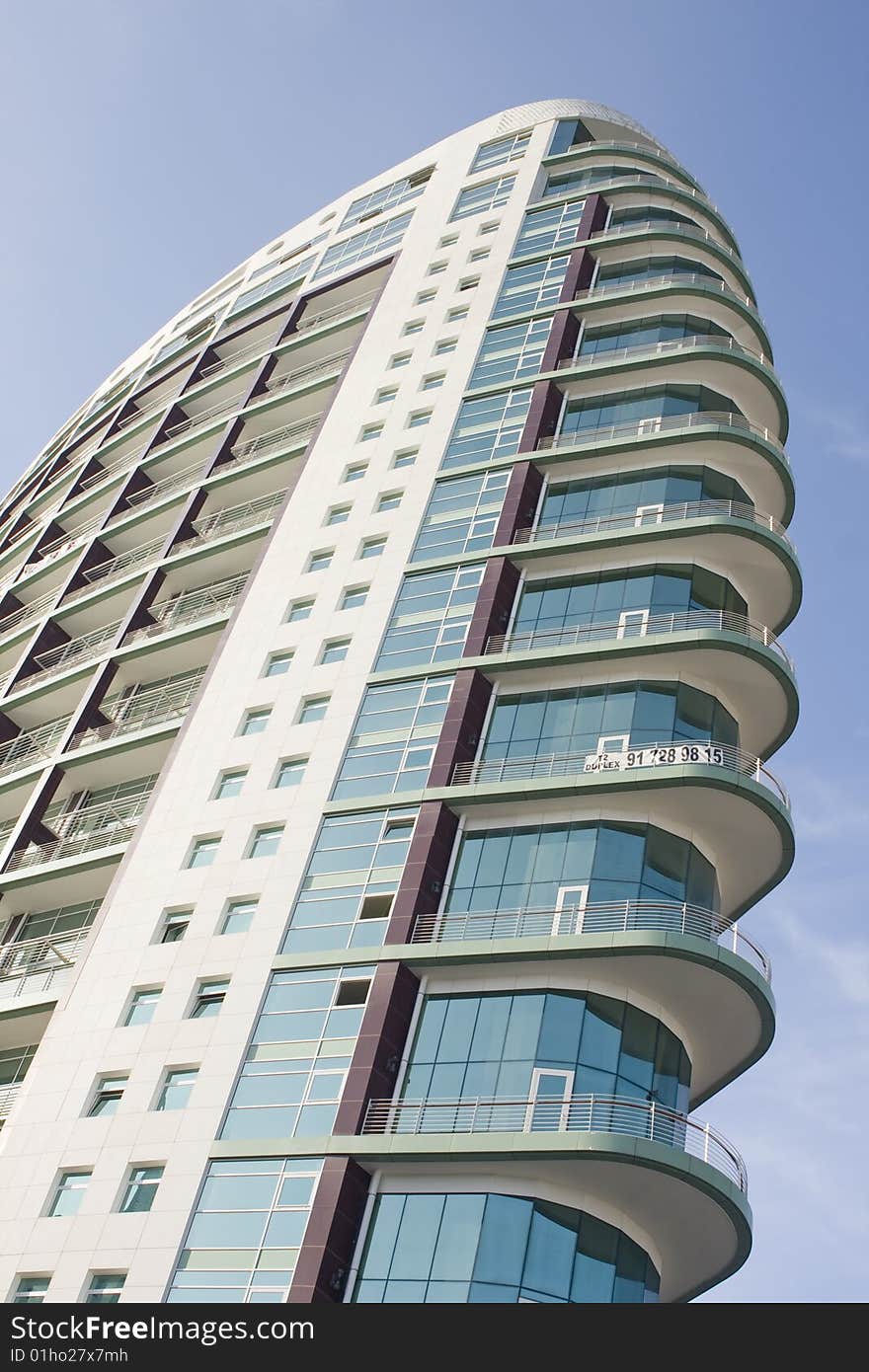 Modern office building on a background of blue sky