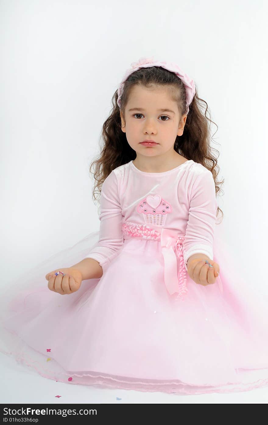 A little girl dressed as a pink princess. A little girl dressed as a pink princess