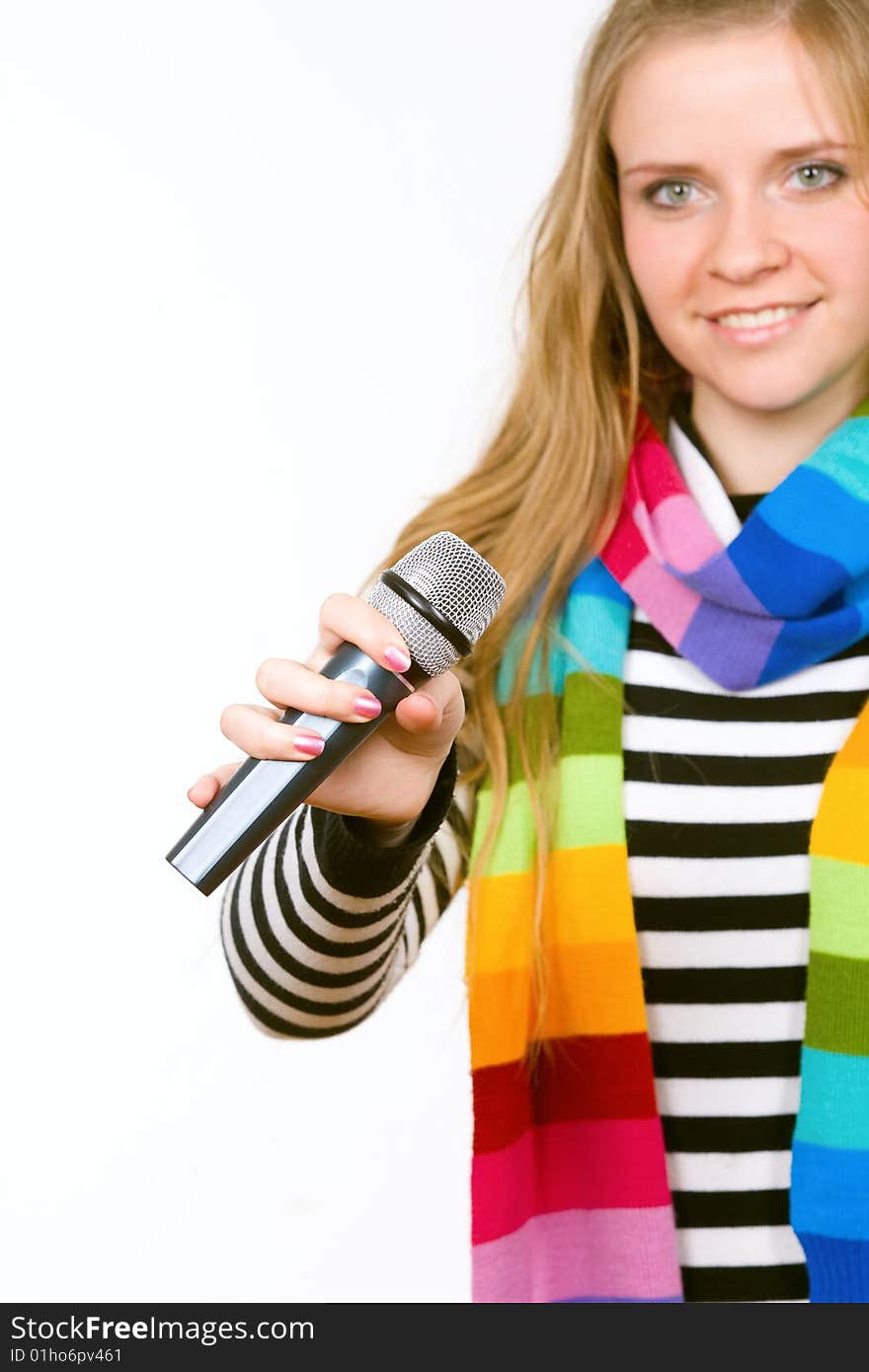 Pretty female with microphone isolated