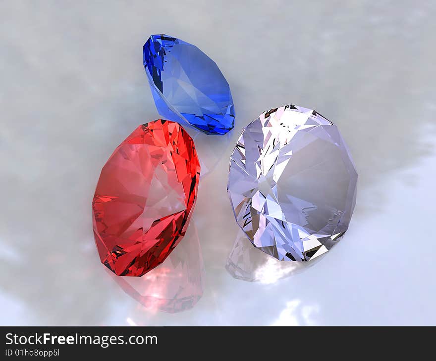 Three colour crystals on a white background with patches of light