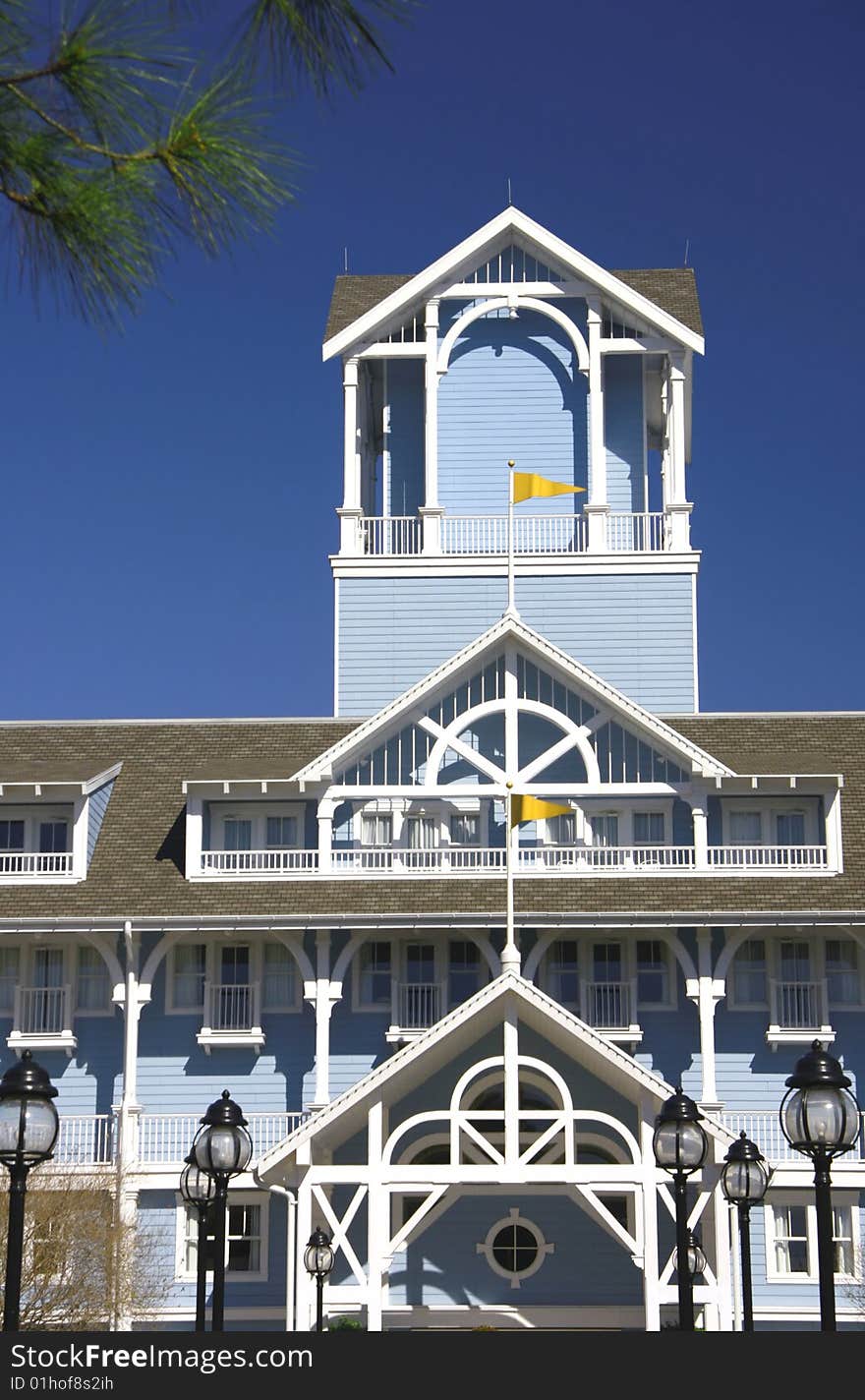 Balcony terrace and tower siding house with yellow flags