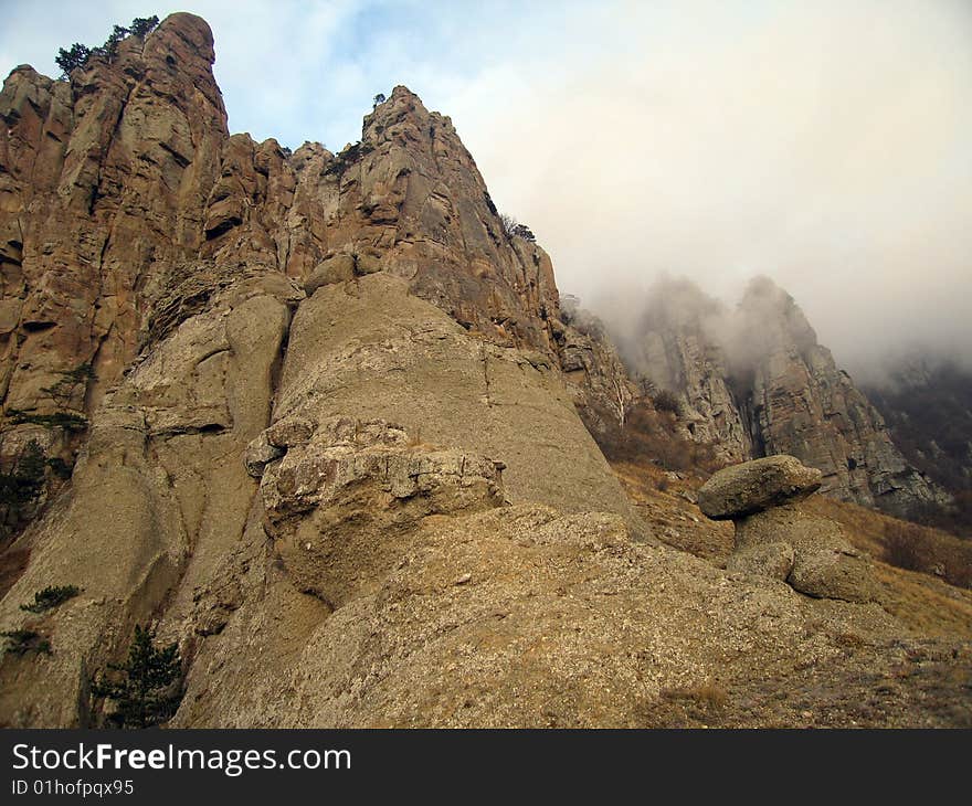 Sunlight Clouds In The Ghosts Vally. Demerdzhi Mountain Rocks, Crimea, Ukraine. Sunlight Clouds In The Ghosts Vally. Demerdzhi Mountain Rocks, Crimea, Ukraine.