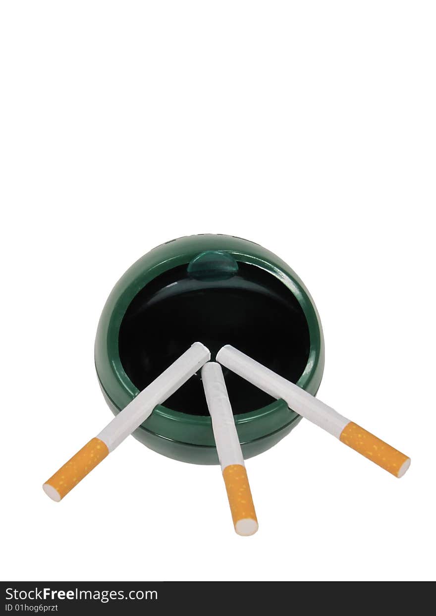 Three unlit cigarettes in an open lid ashtray. Three unlit cigarettes in an open lid ashtray.