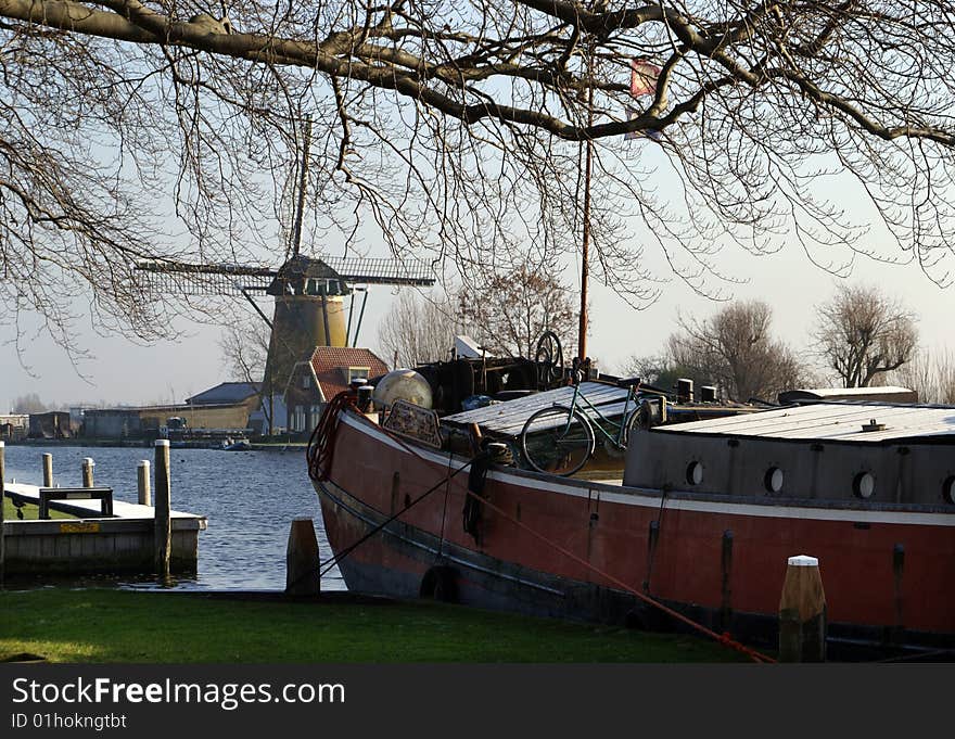 Scenic view on windmill and historic boat