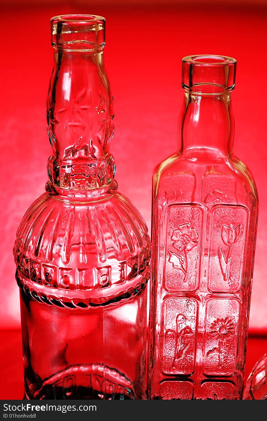 Two bottles on red