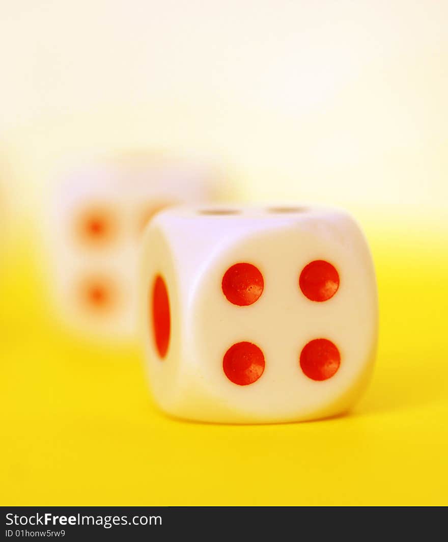 Square dice on color background